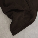 Aquanova Handdoek Pecan, close-up van het Egyptisch katoen met geweven logo